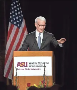  ??  ?? CNN anchor Anderson Cooper speaks after receiving the 2018 Walter Cronkite Award for Excellence in Journalism during a luncheon Wednesday in Phoenix. CHERYL EVANS/THE REPUBLIC