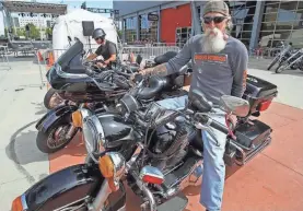  ?? 2014 PHOTO BY MICHAEL SEARS/USA TODAY NETWORK ?? Harley-Davidson riders are loyal, like Tony Sanfelipo of Milwaukee, who sits astride his 2005 Police Road King.