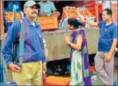  ?? HT PHOTO ?? An armed guard stands by a tomato truck at the Indore vegetable market.
