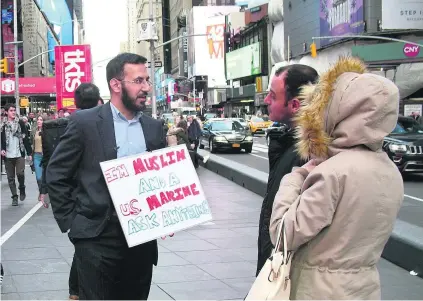  ?? Rob Crilly / The National ?? Mansoor Shams, a Muslim and a US marine, brings his ‘ask anything’ campaign to Times Square in New York.