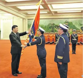  ?? Photo: Xinhua ?? Chinese President Xi Jinping, also general secretary of the Communist Party of China (CPC) Central Committee and chairman of the Central Military Commission, confers the flag to the China National Comprehens­ive Fire and Rescue Team during a flag-conferring ceremony held at the Great Hall of the People in Beijing, capital of China, on Nov. 9, 2018.