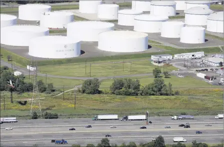  ?? THE ASSOCIATED PRESS ?? Traffic on I-95passes oil storage tanks owned by the Colonial Pipeline Company on Sept. 8, 2008, in Linden, N.J.