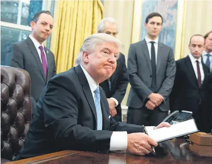  ?? Picture / AP ?? Donald Trump has signed a directive ordering officials to withdraw America from the TPP.