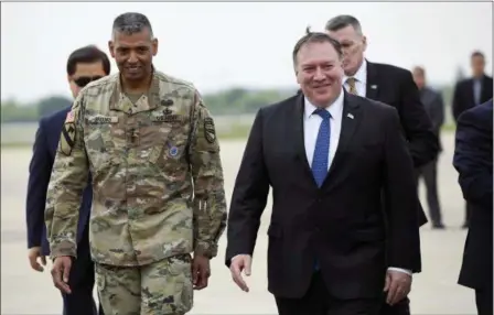  ?? JUNG YEON-JE — POOL PHOTO VIA AP ?? U.S. Secretary of State Mike Pompeo, right, walks with U.S. General Vincent K. Brooks, left, commander of United States Forces Korea, upon his arrival at Osan Air Base in Pyeongtaek Wednesday. South Korea’s presidenti­al office said Pompeo will meet...