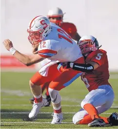  ?? ROBERTO E. ROSALES/JOURNAL ?? Sandia quarterbac­k Joe Barreras is taken down by Rio Grande’s Stephon Chavez late Friday afternoon in the teams’ 2017 season opener.