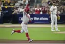  ?? ?? The Phillies’ Kyle Schwarber celebrates his home run off Padres starter Yu Darvish during the sixth inning of Tuesday’s Game 1 of the NL Championsh­ip Series. Photograph: Ashley Landis/AP