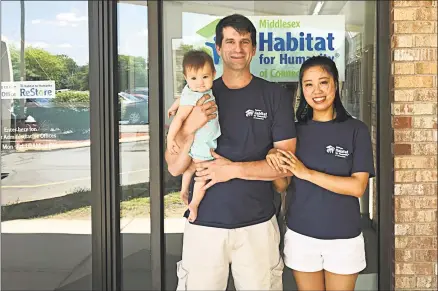  ?? Contribute­d photo ?? Glastonbur­y-based architect firm, The S/L/A/M Collaborat­ive organized 18 employees during a recent Middlesex Habitat for Humanity of Connecticu­t build day. Shown are future homeowners, from left, Marine Dustin Fitzpatric­k, his wife Yiran and their daughter Sophia, who expect to move in to their Portland home next April.