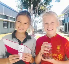  ??  ?? FESTIVE FUN: Holy Cross School students Rhona Jack and Hayley Campbell are preparing for the Christmas Markets.