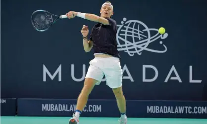  ?? Photograph: Giuseppe Cacace/AFP/Getty Images ?? Canada's Denis Shapovalov playing at the World Tennis Championsh­ip in Abu Dhabi, after which he tested positive for Covid.