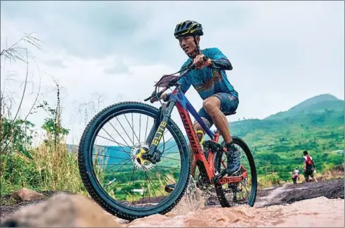  ?? SUPPLIED ?? A Cambodian biker negotiates the rough terrain during the first round of the 2022 WURKZ Mountain Bike Series on Sunday.