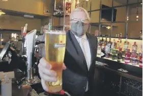  ??  ?? 0 Clockwise from left: Jackson Carlaw after he became leader in February; being congratula­ted by rival Michelle Ballantyne: with a pint and a face mask as pubs reopened when the coronaviru­s lockdown was eased; with Ruth Davidson during her time as leader