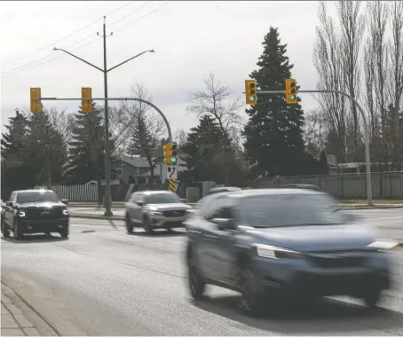  ?? MICHELLE BERG ?? Vehicles drive past the 2400 block of Taylor Street East, where a 16-year-old boy died after a single-vehicle collision early Sunday morning. Two other teens were injured in the crash and rollover, one of whom is in serious condition, police say.