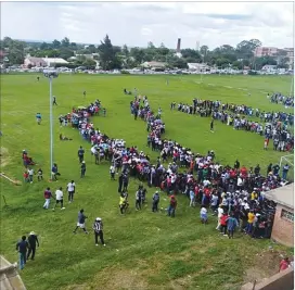  ??  ?? Crowds queue outside entry points at Barbourfie­lds Stadium before the FC PlatinumOr­lando Pirates match