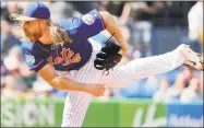  ?? Jeff Roberson / Associated Press ?? New York Mets starting pitcher Noah Syndergaar­d throws during the first inning of an exhibition game against the Houston Astros on Saturday.