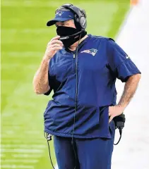  ?? JASEN VINLOVE • USA TODAY SPORTS ?? New England Patriots head coach Bill Belichick looks on during the second half Sunday against the Miami Dolphins at Hard Rock Stadium.