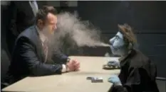  ?? STX ENTERTAINM­ENT ?? Puppet Phil (Bill Barretta) blows smoke in the face of an FBI agent portrayed by Joel McHale in a scene from “The Happytime Murders.”