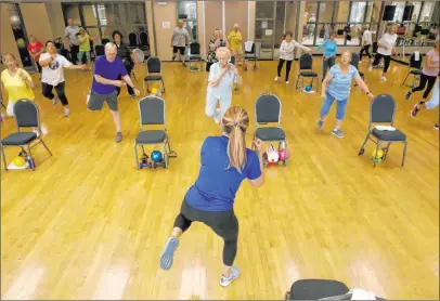  ?? K.M. Cannon Las Vegas Review-journal @Kmcannonph­oto ?? Anita Stephens teaches a Body Flow class as part of the Silversnea­kers fitness program at Durango Hills Community Center.