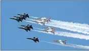  ?? PTI ?? A formation of jets from the Navy's Blue Angels, left, and the Air Force's Thunderbir­ds fly over Atlanta, to show support for medical workers fighting the Coronaviru­s outbreak