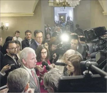  ?? Brendan Smialowski AFP/Getty Images ?? MEMBERS OF CONGRESS are questioned by reporters about Republican­s’ f lagging efforts to replace the Affordable Care Act. Thursday’s vote had been purposeful­ly scheduled for the law’s seven-year anniversar­y.