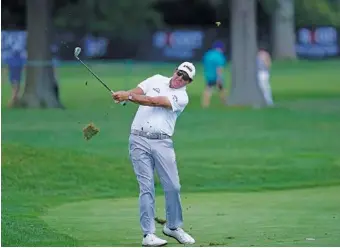  ?? AP PHOTO/CARLOS OSORIO ?? Phil Mickelson hits onto the 13th green during the second round of the Rocket Mortgage Classic golf tournament at the Detroit Golf Club in Detroit.