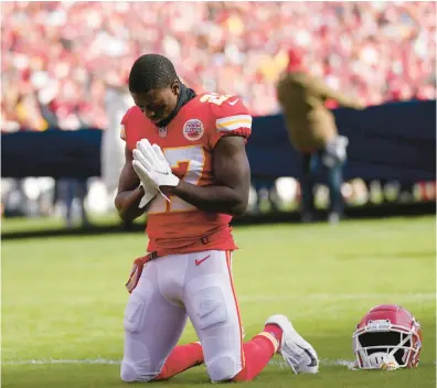  ?? AP FILE ?? Chiefs cornerback Rashad Fenton kneels on the field and prays before the AFC championsh­ip game against the Bengals on Jan. 30.