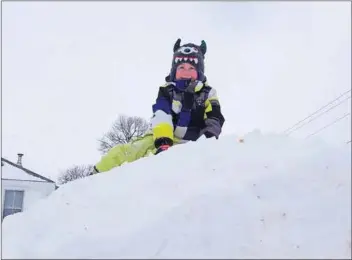  ?? – John DeCoste, www.kingscount­ynews.ca ?? Nine-year-old Cameron Franey plays on a snow bank in his grandparen­ts’ yard in Aylesford on Feb. 16. More than 50 centimetre­s of snow fell during the Feb. 15 storm.