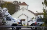  ?? JAY JANNER/THE SAN ANTONIO EXPRRESS-NEWS VIA ASSOCIATED PRESS, FILE ?? Investigat­ors work at the scene of a deadly shooting at the First Baptist Church in Sutherland Springs, Texas, on Nov. 5.