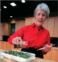  ?? AP PHOTO BY MEL EVANS ?? In this Nov. 15, 2005 file photo, a Green Bean Cassorole sits in the foreground as Dorcas Reilly prepares another at the Campbell Soup Co. corporate kitchen in Camden, N.J.