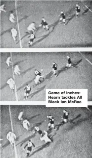  ??  ?? Game of inches: Hearn tackles All Black Ian McRae