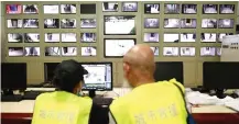  ?? — AFP photo ?? Volunteers reviewing closed-circuit television footage in search of Chen Shaohua at a mall in Beijing where Chen was last seen.