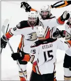  ?? — GETTY IMAGES ?? Patrick Maroon, right, of the Anaheim Ducks celebrates a goal with Francois Beauchemin and Ryan Getzlaf.