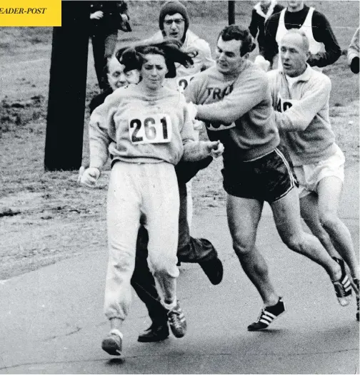  ?? PAUL J. CONNELL/THE BOSTON GLOBE VIA GETTY IMAGES ?? Boston Marathon co-director Jock Semple, in long pants, gets shoved away as he tries to push Kathrine Switzer out of the 1967 race.