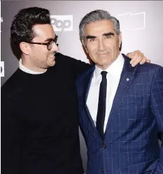  ?? EVAN AGOSTINI/THE ASSOCIATED PRESS ?? “We’re going out on a nice, natural high,” says Eugene Levy, right, with his son Daniel.