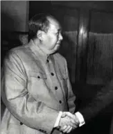  ?? ?? Chairman Mao Zedong shakes hands with Nixon after their meeting in Beijing during the US leader’s official visit to China.