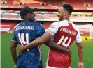  ??  ?? Arsenal’s Pierre-Emerick Aubameyang celebrates his new contract with his father, Pierre. Photograph: Stuart MacFarlane/Arsenal FC/Getty Images