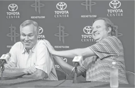  ?? Mark Mulligan / Houston Chronicle ?? Rockets coach Mike D’Antoni, left, and general manager Daryl Morey have reason to joke as they talk about the series of trades that culminated in the team landing star point guard Chris Paul from the Clippers on Wednesday.