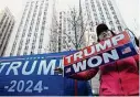  ?? Bryan Woolston/Associated Press ?? Stephanie Lu protests a possible indictment against former President Donald Trump on Monday at the New York Criminal Courts building.