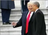  ?? THE ASSOCIATED PRESS ?? President Donald Trump and former President Barack Obama talk as they pause on the steps of the East Front of the U.S. Capitol on Friday.