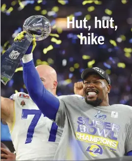  ?? ?? Von Miller holds up the Vince Lombardi Trophy after Super Bowl LVI