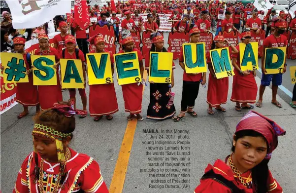  ?? (AP) ?? MANILA. In this Monday, July 24, 2017, photo, young Indigenous People known as Lumads form the words "Save Lumad schools" as they join a march of thousands of protesters to coincide with the state of the nation address of President Rodrigo Duterte.