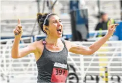  ?? STAFF PHOTO BY ANGELA LEWIS FOSTER ?? Kimberly Bradley approaches the finish line for the women’s race win on Sunday at the Chattanoog­a Marathon near the First Tennessee Pavilion. Bradley, who is from Colorado, is trying to finish a marathon in all 50 states.