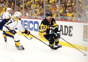  ?? (Reuters) ?? PITTSBURGH PENGUINS captain Sidney Crosby (right) made his presence felt throughout Game 5 of the Stanley Cup Final – a 6-0 Penguins’ victory over the Nashville Predators – from dishing three dazzling assists to slamming Predators defenseman P.K....