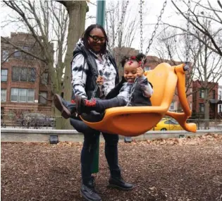  ?? AP PHOTO/ERIN HOOLEY ?? Chicago educator Tamisha Holifield spends time with her 2-year-old daughter Rian Holifield in 2022 at Nichols Park in the Hyde Park neighborho­od of Chicago.