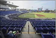  ?? ALFREDO ZUNIGA — THE ASSOCIATED PRESS ?? A man watches a profession­al baseball game between Boer de Managua and Flecheros de Matagalpa at Dennis Martinez stadium in Managua, Nicaragua on April 25.