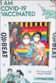  ?? PTI ?? People pose for a photo after receiving the first dose of the Covid vaccine, in Kolkata on Sunday.