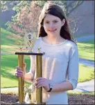  ?? Photo contribute­d by Lynne Manna ?? Berry College Middle School eighth-grader Anna Davidson holds her Georgia Independen­t School Associatio­n Middle School Unit Spelling Bee trophy. She will participat­e in the state bee at the Jimmy Carter National Historic Site in Plains March 16.