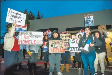  ?? ERIC DAVIDOVE – STAFF PHOTOGRAPH­ER ?? Tenants at two Redwood City apartment buildings who are facing large rent hikes next month and supporters protest outside the new owners’ offices Tuesday.