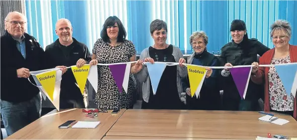  ??  ?? The group gather to make plans for Stobswell Christmas festivitie­s — set to be the community’s “biggest and best yet”.