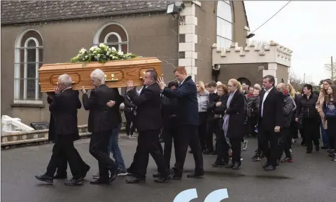  ??  ?? The funeral procession arrives at Kilmore Church.