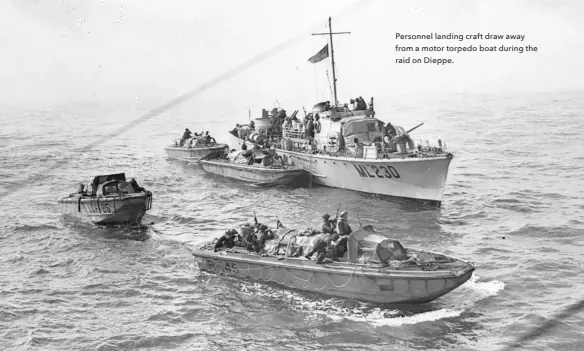  ??  ?? Personnel landing craft draw away from a motor torpedo boat during the raid on Dieppe.
